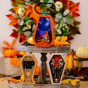 Spooky Silhouette Lantern Trio ornaments, including a pumpkin lantern and two coffin-shaped ornaments with RIP and skull