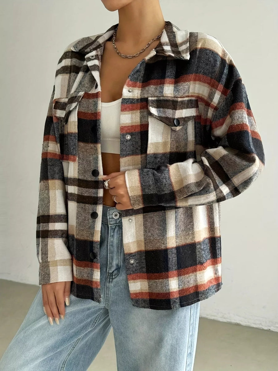 Relaxed fit plaid shirt jacket in mocha with buttoned chest pockets and a collared neckline.