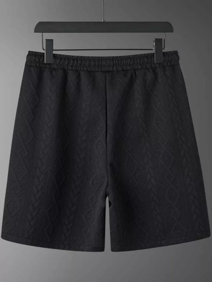 Black knit shorts with diamond pattern and elastic waistband