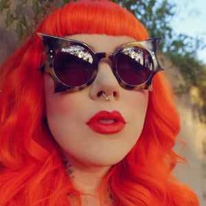 PC Frame material: Polycarbonate Lens material: Polycarbonate Temple material: P sunglasses in Caramel with boxy silhouette