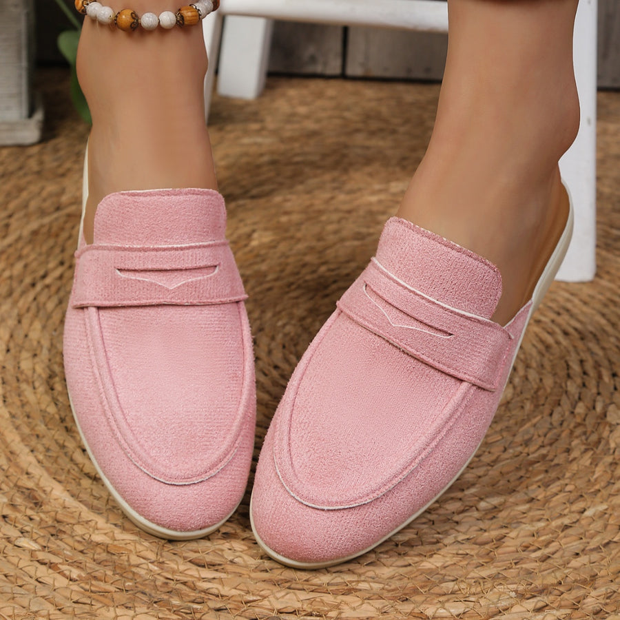Pink textured round toe slip-on loafers with decorative strap detail