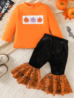 black pajama set featuring long sleeve and pumpkin embroidery, spiderweb print