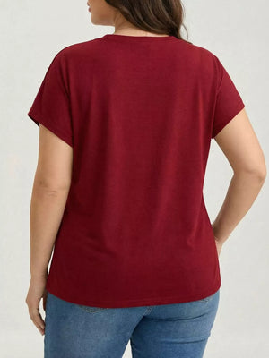 Plus-size burgundy crew neck t-shirt with short sleeves and a ruched hem detail.