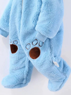 Pastel blue fleece baby snowsuit with bear paw details on legs.