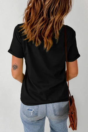 Black graphic tee with rolled sleeves and an eye tattoo on the arm.