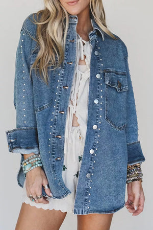denim jacket in medium wash blue featuring buttoned and regular fit