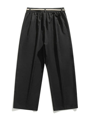 Black relaxed fit sweatpants with a belted waist and drawstring detail.