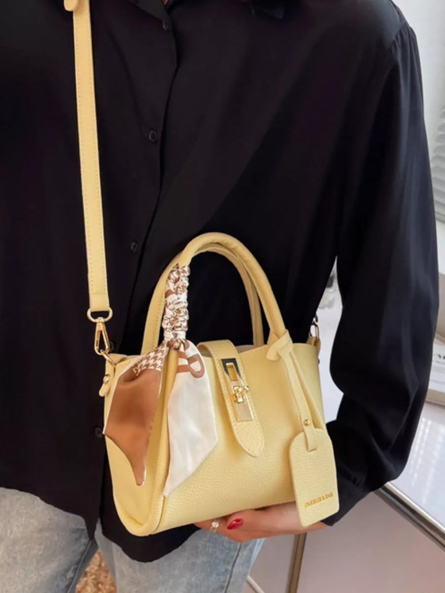 Yellow crossbody bag with scarf detail and gold hardware
