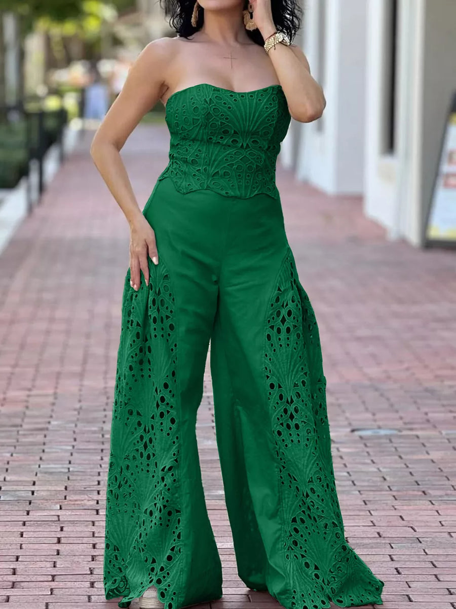 Green strapless two-piece ensemble with intricate openwork detailing on the bodice and wide-leg pants.
