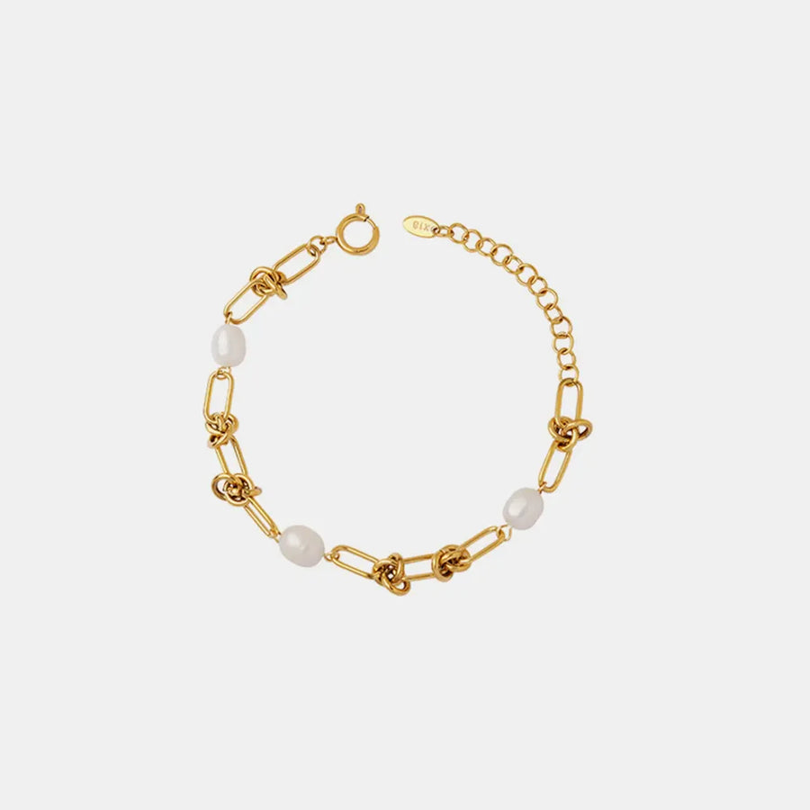 Gold knot and pearl link bracelet with adjustable chain closure