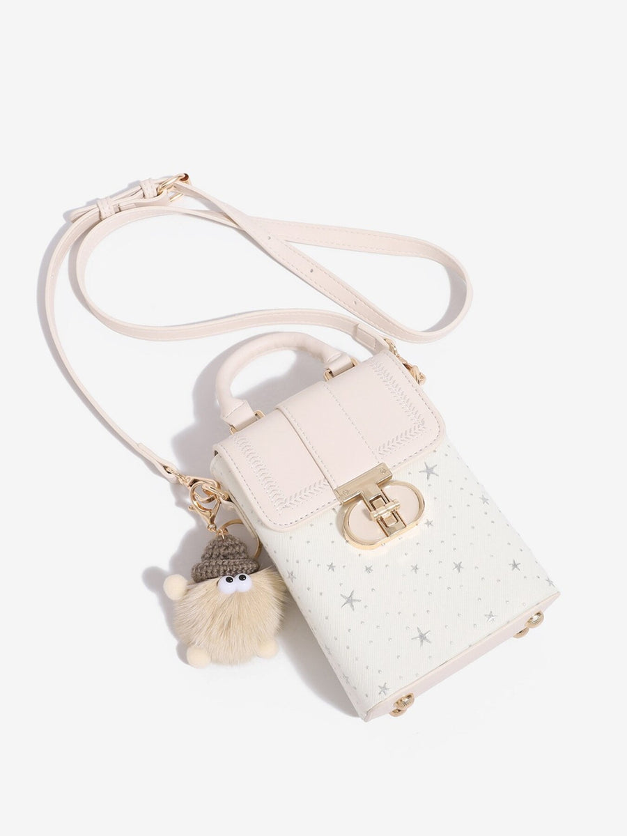White crossbody bag with turn-lock and star-print