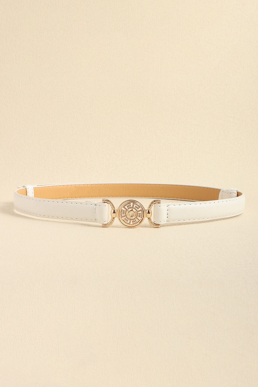 White leather belt with gold circular embellished buckle and adjustable strap