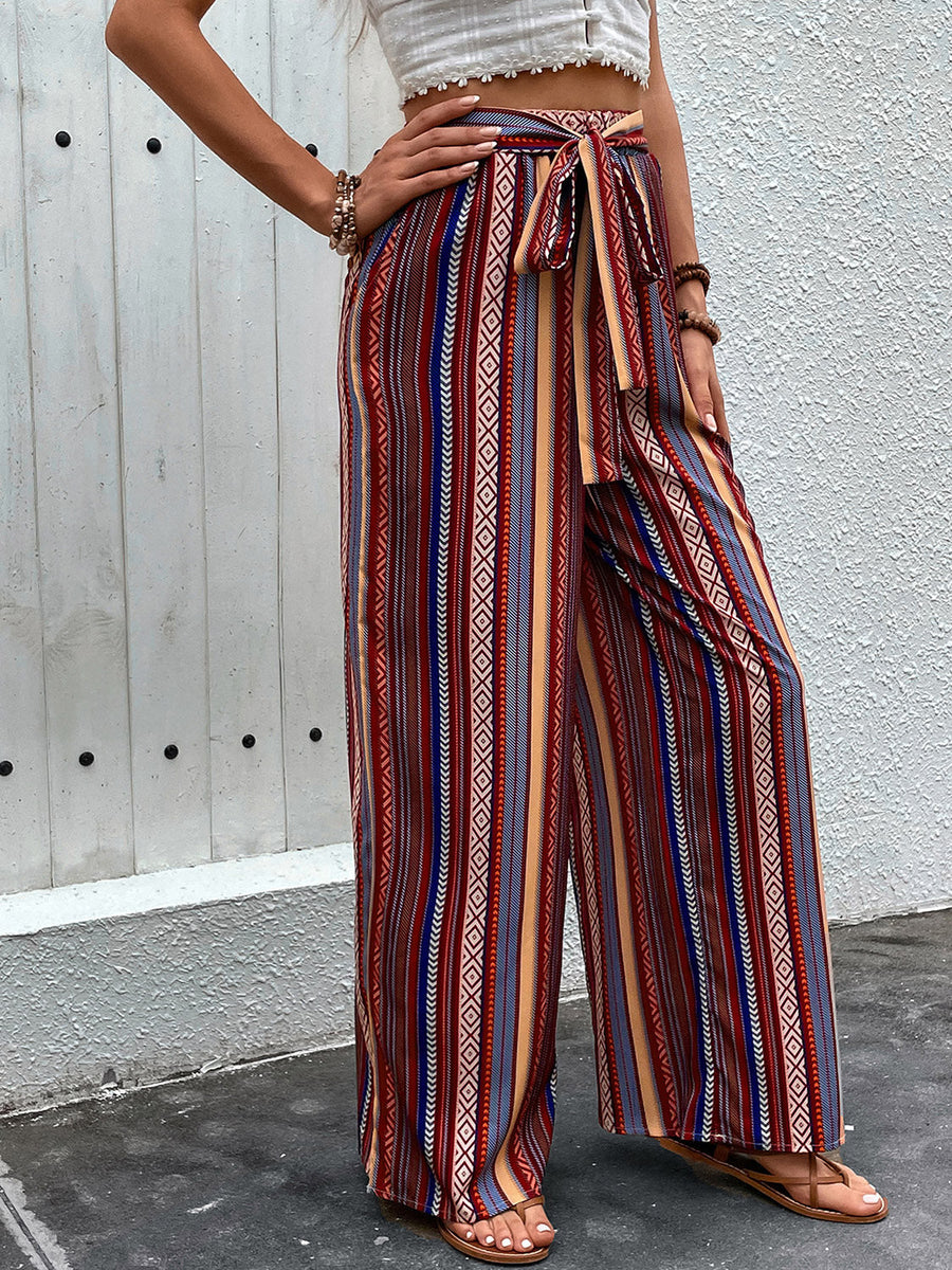 Bohemian stripe palazzo trousers in rust with tie-waist and wide leg