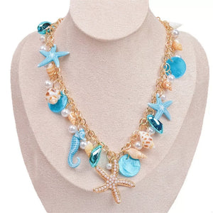 necklace in gold with charms and choker
