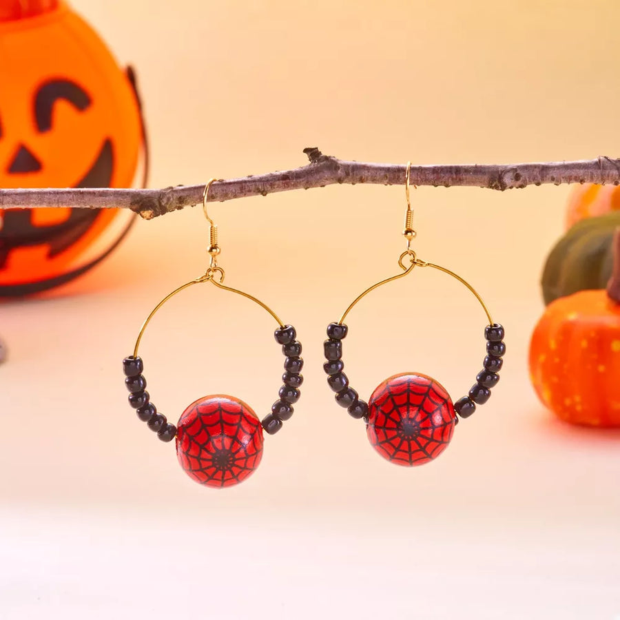 earrings in red with spiderweb and gold-plated
