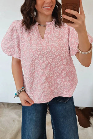 Textured floral puff sleeve maternity shirt in blush pink with a V-neck.