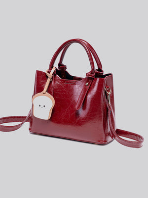 handbag in Wine Red with top handle and medium