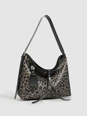 black shoulder bag featuring shoulder strap and leopard-print