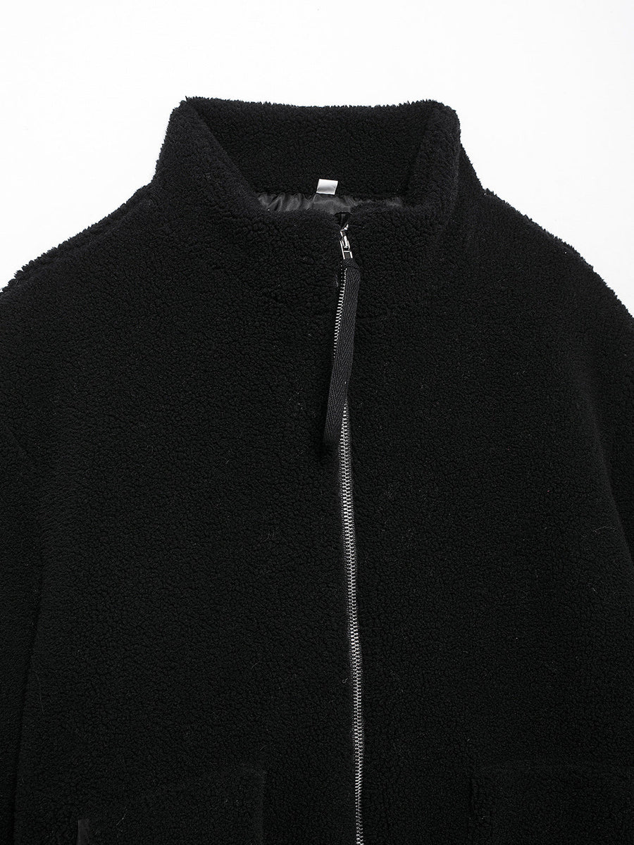 Black sherpa jacket with stand collar and full zip closure.