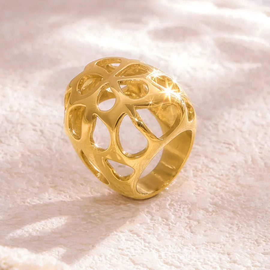 Gold openwork orb ring with a contemporary, hollow design.