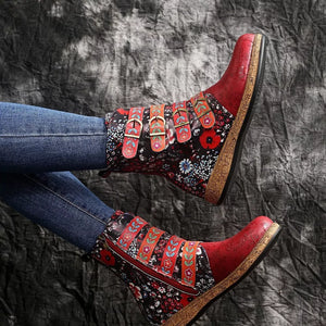 Red and blue floral embroidered suede ankle boots with decorative buckle straps and side zipper.