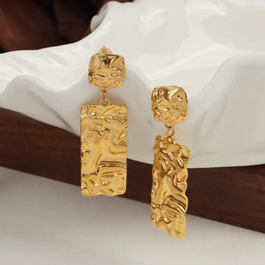 Gold-plated crinkle drop earrings with sculptural texture.