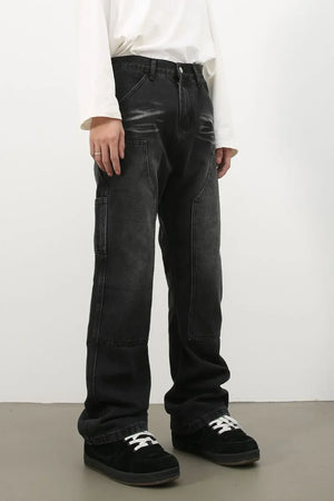 Carpenter jeans in washed black denim with relaxed fit and utility pockets.
