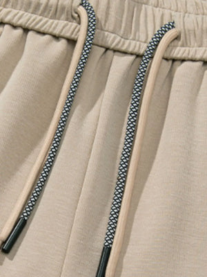 Khaki lounge trousers with drawstring detail and elastic waistband