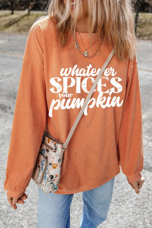 Textured graphic crewneck pullover in sherbet orange with "whatever spices your pumpkin" text.