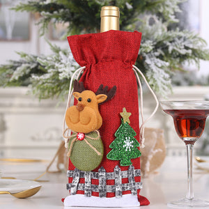 Red wine bottle gift bag with reindeer and Christmas tree applique.
