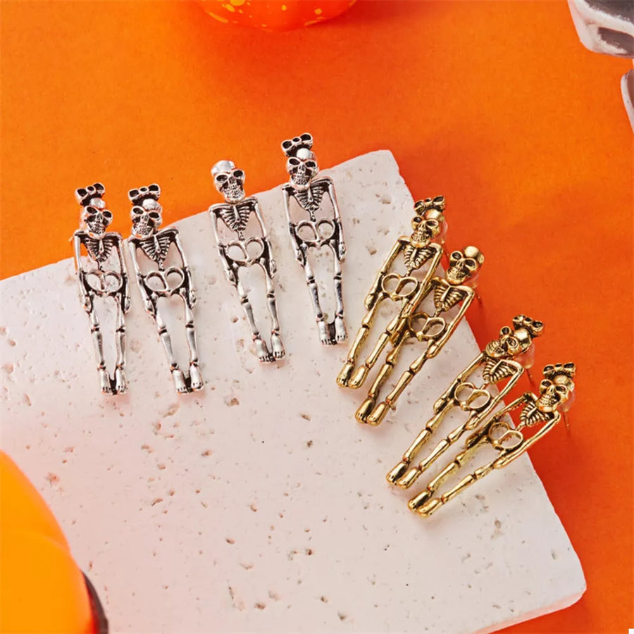 silver earrings with skeleton and not applicable