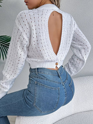 White openwork knit sweater with backless detail and basketweave pattern.