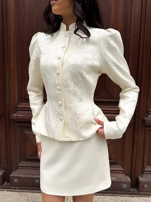 Apricot peplum top featuring buttoned and floral
