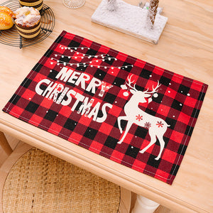 Festive plaid placemat with Merry Christmas text and reindeer design.
