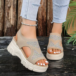Khaki open-toe platform sandals with geometric patterned knit upper and chunky sole.