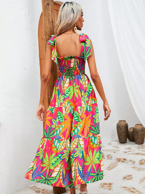 Tropical tie-strap smocked midi dress in strawberry with a tiered skirt and leaf print.