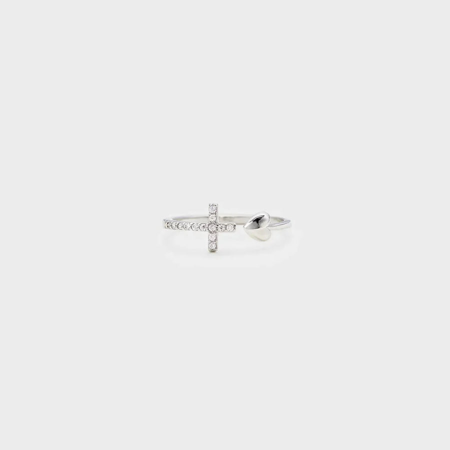 Silver ring with open heart and diamond-accented cross detail