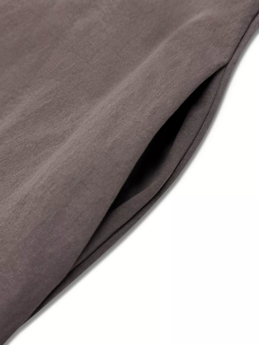 Elegant midi dress in coffee brown with a visible side pocket detail.