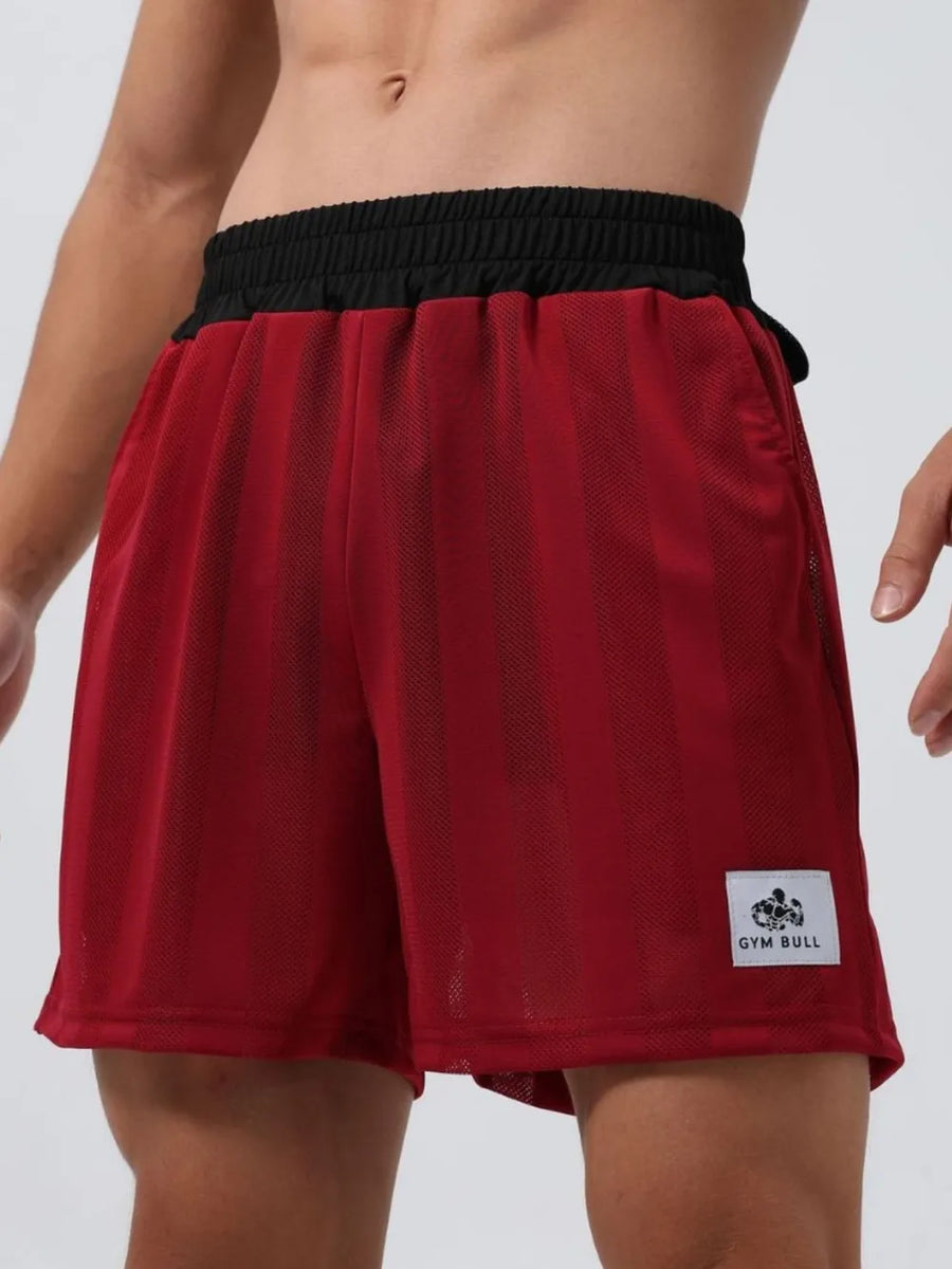 Deep red performance mesh training shorts with vertical stripes and black waistband.