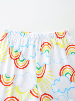 Toddler underwear with white fabric, elastic waistband, and a cheerful rainbow and cloud print.