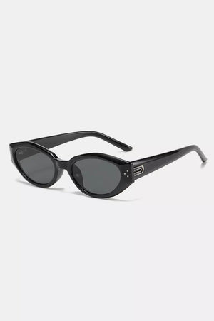 Black cat-eye sunglasses with metallic accents and decorative studs.
