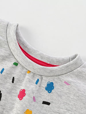 Light gray cotton crewneck sweatshirt with colorful cartoon sprinkles and flowers pattern.