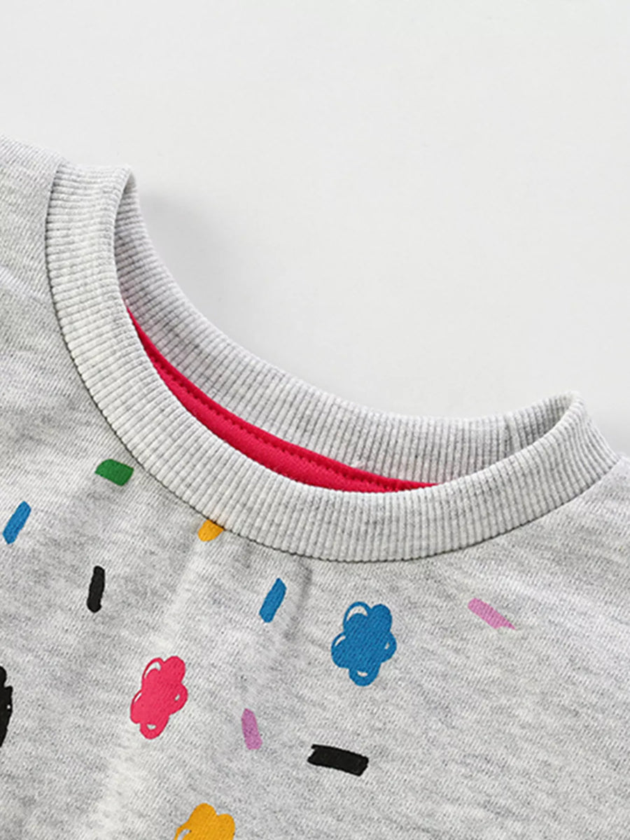 Light gray cotton crewneck sweatshirt with colorful cartoon sprinkles and flowers pattern.