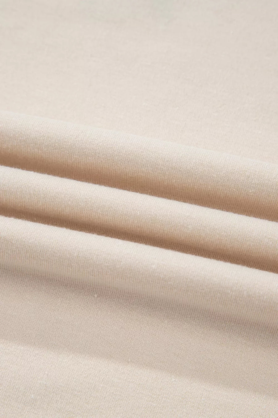 sweatshirt in tan with exposed seam and hip-length