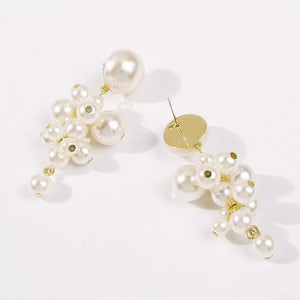 earrings in gold with cluster design and long