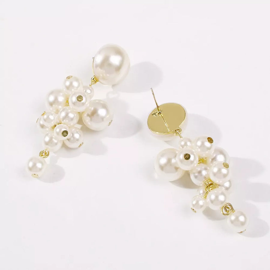 earrings in gold with cluster design and long