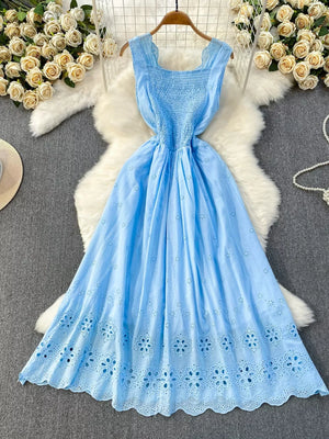 Blue eyelet maxi dress with smocked bodice and cutout detail