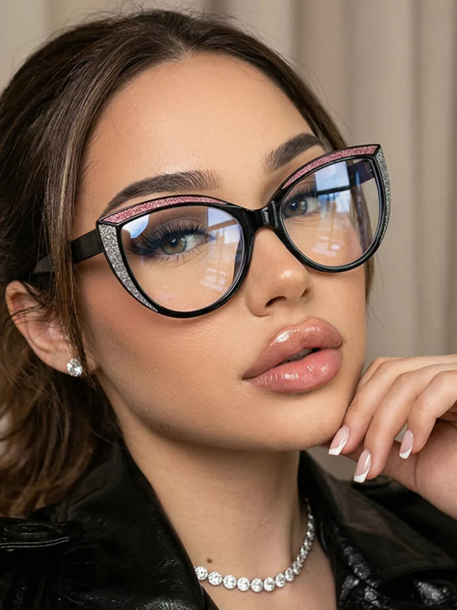 PC Frame material: Polycarbonate Lens material: Polycarbonate Temple material: P sunglasses in brown with cat-eye silhouette