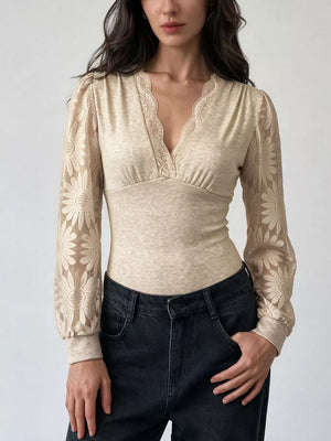 light beige bodysuit with floral and v-neck