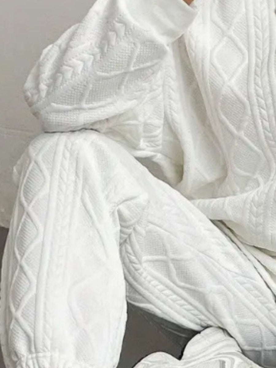 White cable knit loungewear set with textured pattern detail.